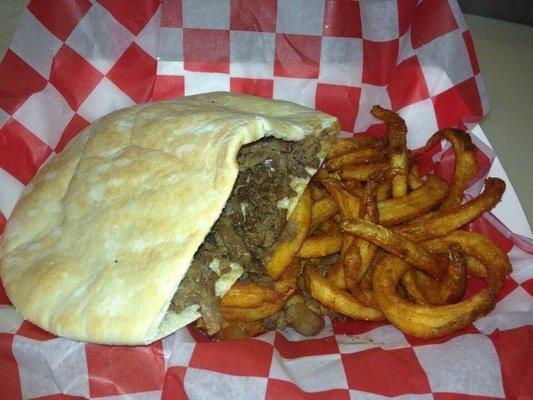 Steak in a sac with curly fries