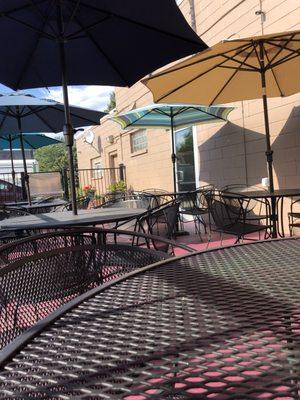 Outdoor seating with new umbrellas.