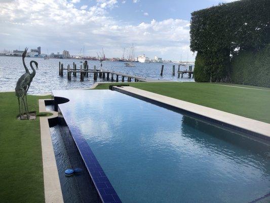 One of our customer on the water. Beautiful pool with infinity edge on half the pool!