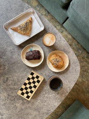 Vegan sourdough pastelito, vegan pain au chocolat, and vegan sourdough croissant with oat milk latte and aeropress.