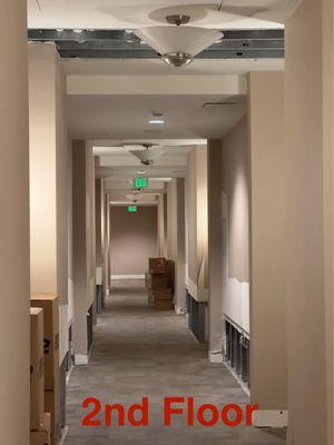 The 2nd floor hallway has been missing moulding and dry wall for over 3 years after a rooftop flood.  The ceiling is also exposed.