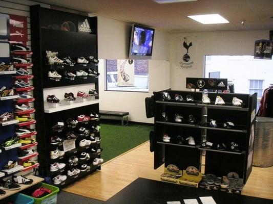 Customers can test out shoes in our turf room and  watch live games on our two plasma TV's.