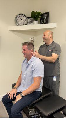 Dr. Mathew Eisen performing a Chiropractic adjustment