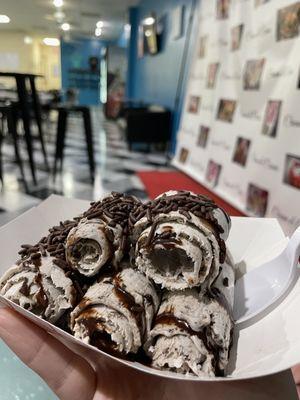 Rolled ice cream - vanilla base, chocolate sprinkles and chocolate drizzle