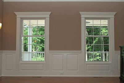 Fluted Pilasters and Pediment Head Window and Door Treatments go well with Custom Wainscoting