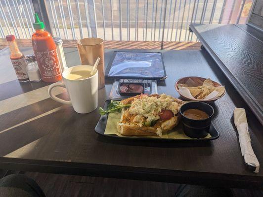 Atol de elote, pan con pollo, and bean dip with chips