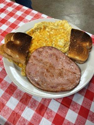 Cheese omelette with ham steak.