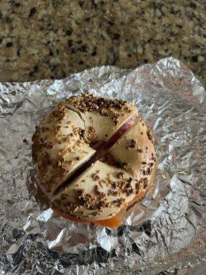 Lox, Cream Cheese, Tomato, Onion, & Capers on a garlic bagel