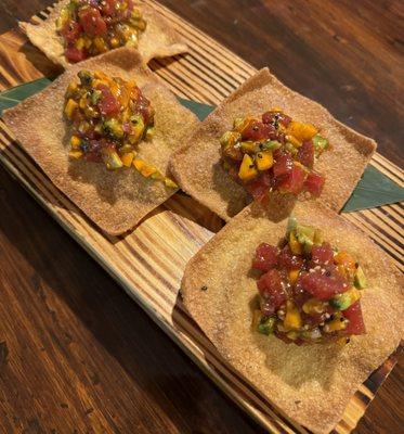 TUNA CRACKER - Fried crispy wonton topped with avocado, mango, red onion, fresh chopped tuna, kimchee sauce