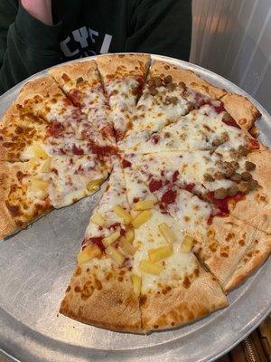 Thick crust pineapple and sausage pizza