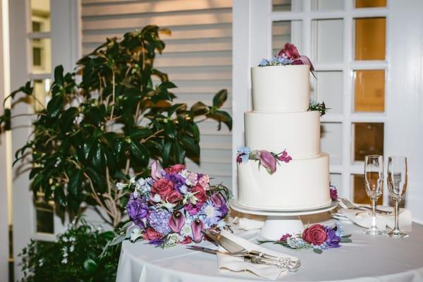 Bridal bouquet and flowers styled on wedding cake