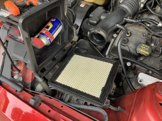 WD-40 bottle in the air intake left by T&T Auto Repair