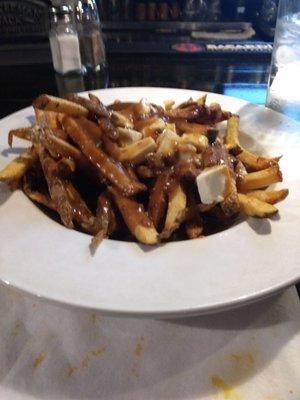 Poutine! Cheese curds and gravy over a bed of the best home fries in the neighborhood.