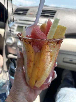 Fruit cup lined with tahini and lime on rim.