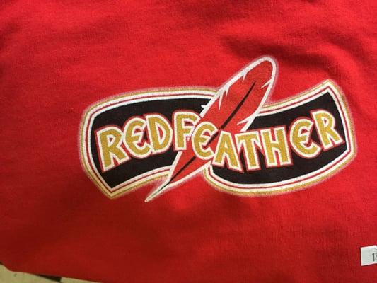 Red Feather souvenir shirt logo