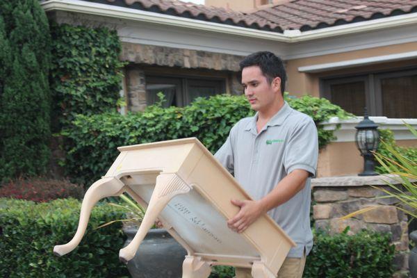 Jeff moving a side table.