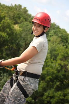 A student gets ready to rappel down the 40-foot tower on campus.