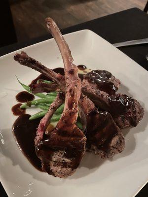 Rack of lamb over lobster ravioli and green beans