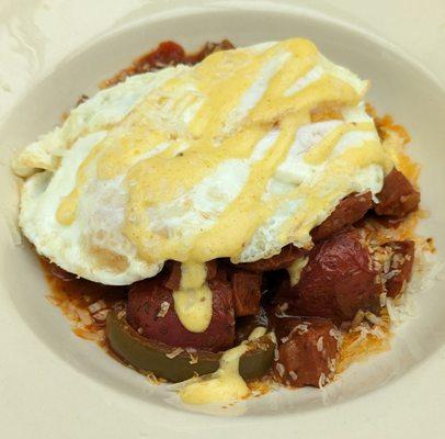 Italian Hash - sausage, potatoes, red peppers, onions, pomodoro sauce, over easy eggs, Hollandaise sauce