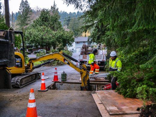 Crew doing trench work for a septic to sewer