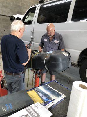 Replacing an in-tank fuel pump with new filter.