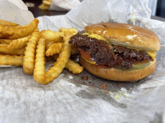 Double cheeseburger with bacon and grilled onions.