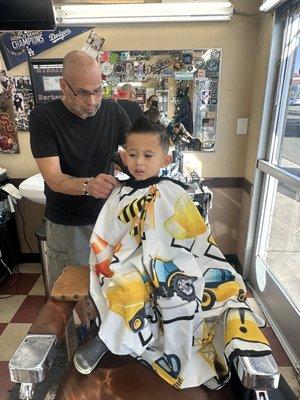 Sergio cutting my sons hair