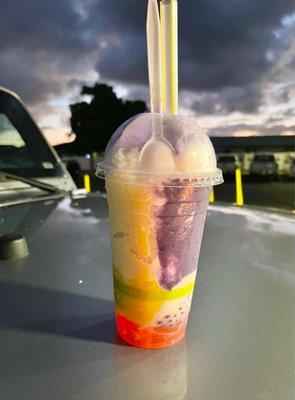 Halo Halo: dessert in Philippines w/crushed ice, condensed milk, ube, sweetened beans, coconut strips, boiled taro and ube ice cream.