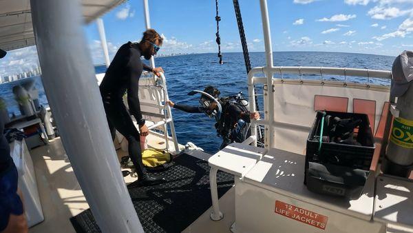 Helping a diver get back on the boat