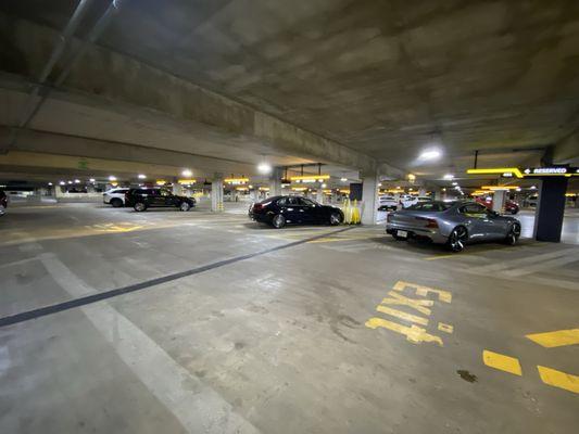 Cars sitting behind the rental counter.