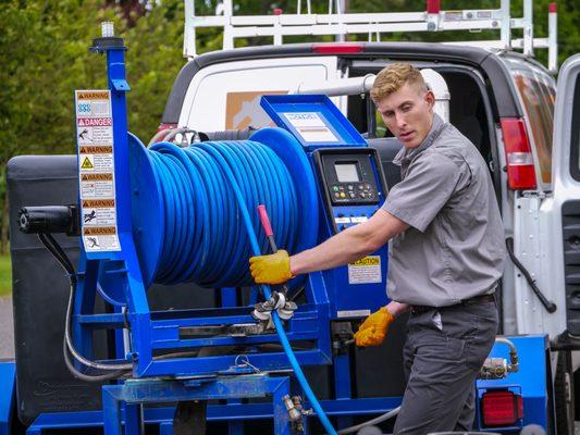 Drain Technician working with the harben jetter