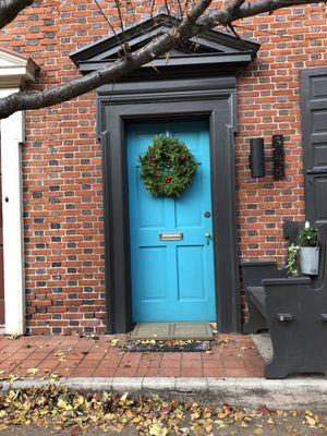 blue door and nice bench