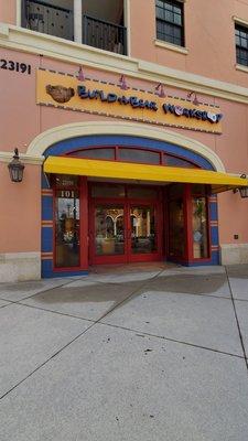 Exterior and entrance of store as it faces Fashion Drive at Coconut Point mall in Estero Florida.