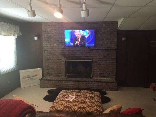 Install flat screen t.v on a solid brick fireplace.