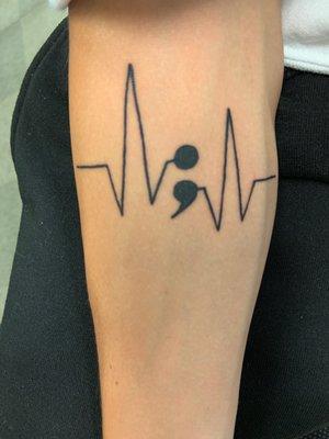 EKG symbol with the depression semicolon and the semi colon means that when I was at my end their was another start in my life