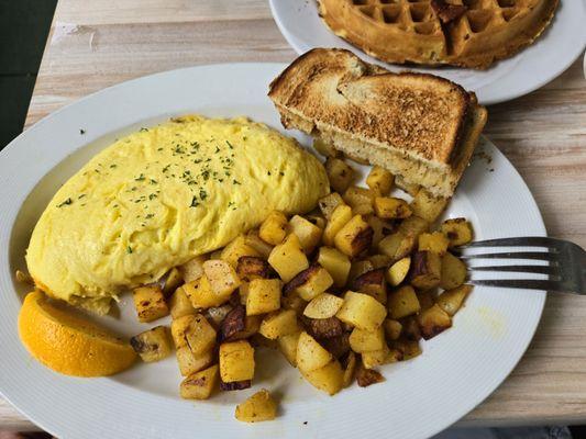 Mushroom and cheese omlete, home fries, toast.