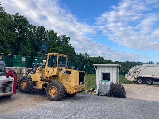 Heavy machinery and dumpsters ready for waste management services at Eagle Transfer Services.