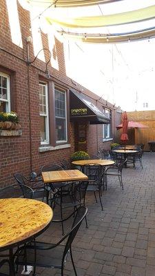 Entrance located under the awning on the patio.