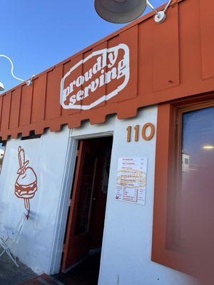 Love the happy orange and white storefront inside colorful and happy vibe. Food is delicious. Fries are delicious.Will be back