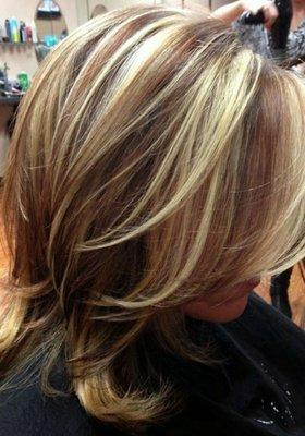 Chunky dark carmel and blonde high lights.