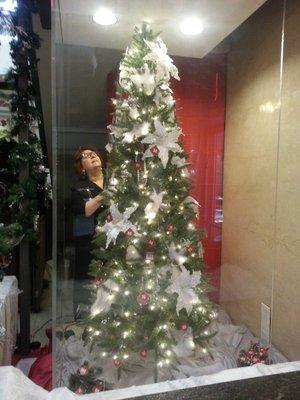 Myriam decorating the "Million Dollar Tree" in 2013