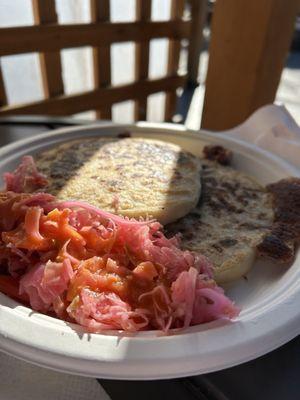 Pork and bean and cheese papusas with curtido.