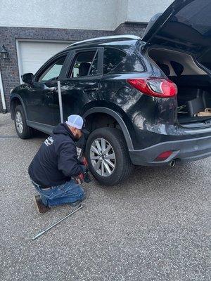 Here I am performing a tire change on a 2014 Mazda cx9 (using spare tire)