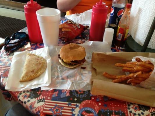 A fried peach pie. A double bacon cheeseburger and seasoned fries.