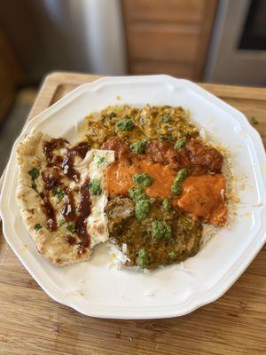 Lamb Vindaloo, Butter Chicken, Saag Lamb and Nizami Korma Chicken. Garlic Naan and Chutney sauces of course.