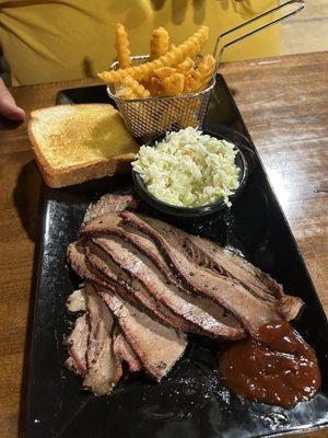 Sliced brisket, slaw and fries.