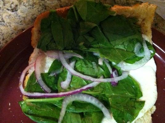 6 inch egg and cheese on white bread with spinach, onions, and a little bit of vinaigrette.