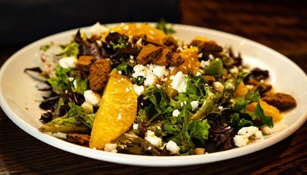 FLORIDA ORANGE & GOAT CHEESE SALAD Mixed local greens, orange segments, goat cheese, ginger cookie crumble, blueberry mango vinaigrette