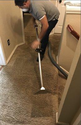 Extracting water from carpet.