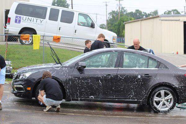 Church members help wash cars for free at its annual Impact Ashland weekend.